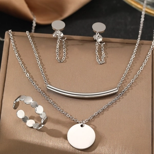 Elegant silver stainless steel layered necklace set with round pendant, earrings and ring
