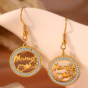 Macro shot of gold-plated Mama heart earrings with sparkling cubic zirconia inlay