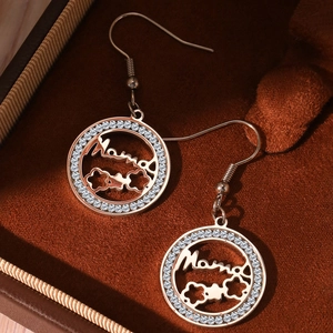 Macro detail of rose gold Mama heart pendant with micro-pave zircons for Mother's Day