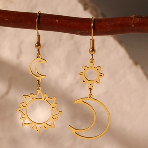 Bohemian gold sun and moon earrings with asymmetrical celestial geometric design