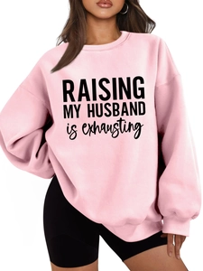 Detailed view of humor text print on pink thick crewneck sweatshirt for women