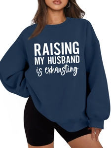 Detail view of navy blue crewneck sweatshirt with Raising My Husband text print