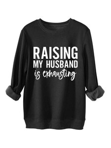Detail of black sweatshirt showing the inner fleece lining and high-quality printed slogan