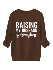 Detail of coffee brown sweatshirt ribbed cuffs and RAISING MY HUSBAND print text