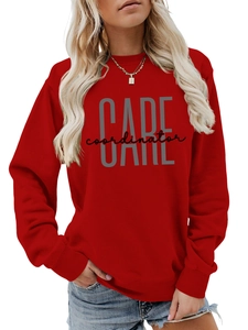 Close-up of red crewneck sweatshirt with CARE coordinator graphic print and ribbed cuffs