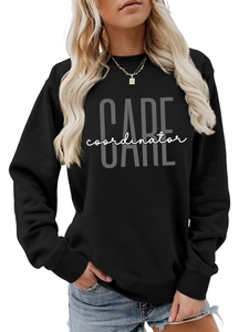 Detail of black cotton sweatshirt featuring CARE coordinator print and ribbed cuffs