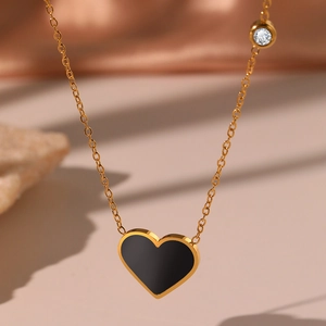 Elegant gold chain necklace with black heart pendant and sparkling zircon stone accent