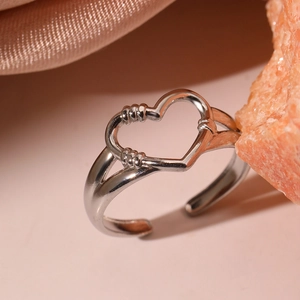 Minimalist silver open ring featuring a hollow heart design and fine wire-wrapped details