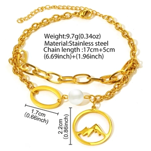 Bracelet double couche en acier doré avec perle blanche et pendentif montagne