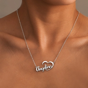 Custom silver stainless steel name necklace featuring Angelina pendant with hollow heart detail
