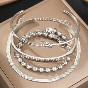 Silver-toned 4-piece bracelet set with heart pendant and minimalist open bangles