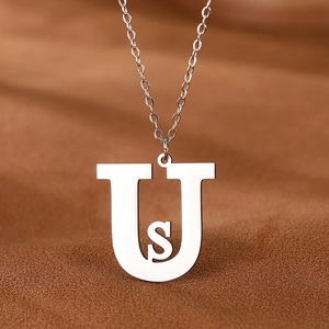 Polished silver stainless steel necklace featuring capital U and small s letter pendants