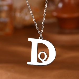 Minimalist silver stainless steel necklace with custom letter D and Q pendant charm