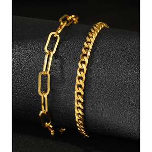 Minimalist gold anklet set with paperclip and Cuban link chains on display