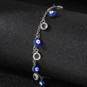 Silver stainless steel Evil Eye beaded bracelet with blue charms and clear crystals
