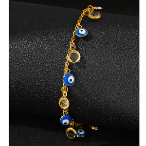 Gold plated evil eye bracelet with blue enamel pendants and clear crystals for women