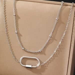 Silver double-layer titanium steel necklace with oval pendant on leather stand