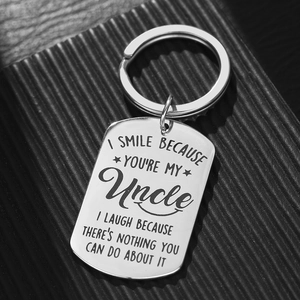 Minimalist stainless steel rectangle keychain with engraved uncle quote on black background