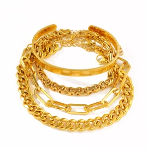 Set di 4 bracciali dorati con rigido, catena cubana e maglia a graffetta