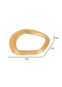 Detailed view of irregular golden metal napkin ring showing matte finish and dimensions