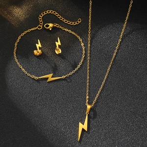 Golden lightning bolt jewelry set with polished necklace bracelet and stud earrings