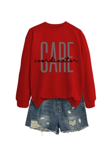 Detail of red crewneck sweatshirt with CARE lettering and distressed denim shorts set
