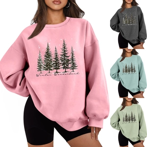 Detail of Winter Wonderland forest print and soft fleece texture on oversized sweatshirt