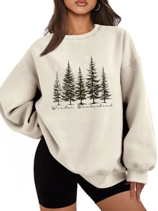 Detail of Winter Wonderland beige sweatshirt showing pine tree print and ribbed collar