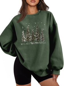 Detail of forest green oversized sweatshirt with white Winter Wonderland pine tree print