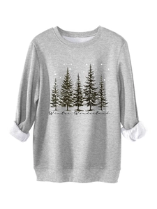 Detail of grey winter sweatshirt with pine tree print and thick white fleece lining