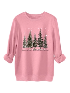 Detail of pink sweatshirt cuff and hem featuring black winter forest and snowflake prints