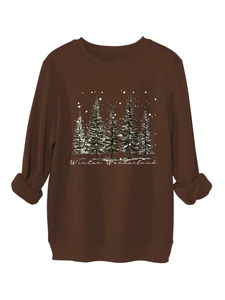 Detailed view of brown winter sweatshirt with pine tree graphic and Winter Wonderland script