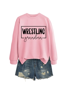 Pink wrestling grandma crewneck sweatshirt paired with distressed blue denim shorts