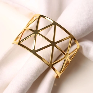 Golden geometric hollow triangle napkin ring for elegant wedding and dinner table decor