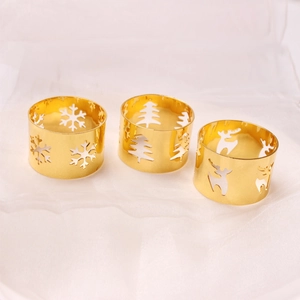 Golden Christmas napkin ring set with snowflake, reindeer and tree hollow designs