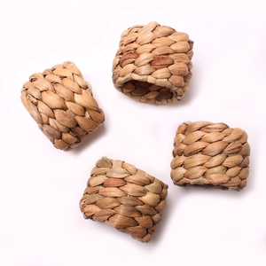 Set of 4 handmade woven water hyacinth napkin rings with natural grass texture for dining