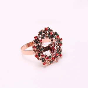 Detail of Christmas cardinal bird napkin ring with red rhinestones and green wreath