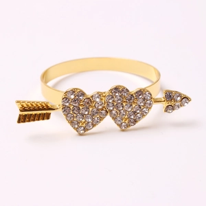 Golden heart napkin ring with arrow design and sparkling white rhinestones for table decor