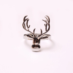 Detailed close-up of silver elk head napkin ring showing intricate antler craftsmanship