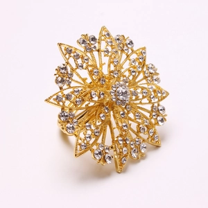 Luxurious gold floral napkin ring with hollow petals and sparkling rhinestone inlay