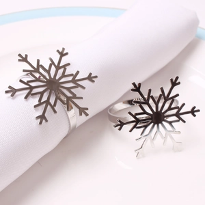 Polished silver snowflake napkin rings set for elegant Christmas dining table decor