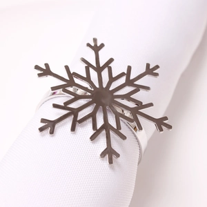 Silver snowflake napkin ring made of polished metal for Christmas table decoration