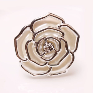 Silver-plated metal rose napkin ring with layered cream-white enamel petals for table decor