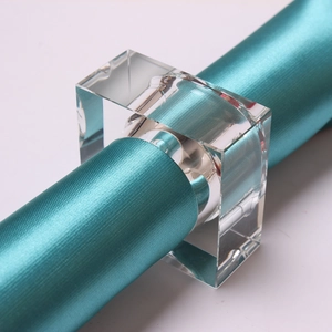 Macro shot of a square clear crystal napkin ring with a round hole for table decoration
