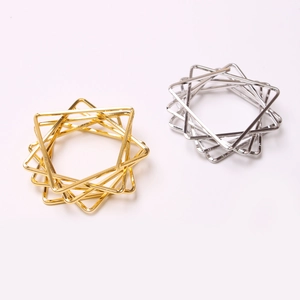 Modern geometric star napkin rings in gold and silver plating with multi-layer design