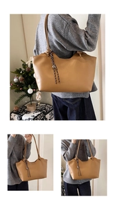 Detail view of the brown leather tote bag with braided tassel and spacious interior