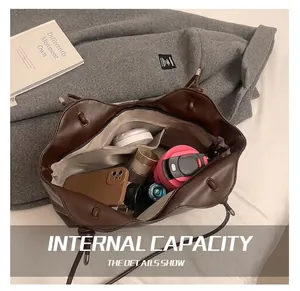 Internal view showing large storage capacity of this vintage dark brown tote bag