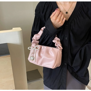 Pink pleated PU leather cloud bag with pearl bow charm and silver heart pendant
