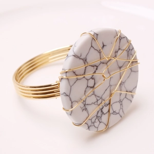 Handmade marble and turquoise napkin ring with golden copper wire weave and metal band