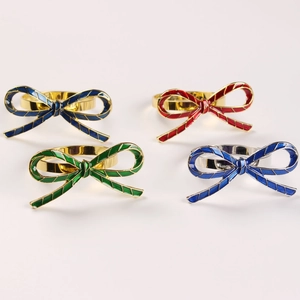 Detailed set of four enamel bowknot napkin rings in blue, red, green and light blue colors